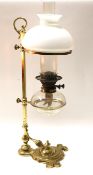 A Victorian brass rise and fall oil lamp.