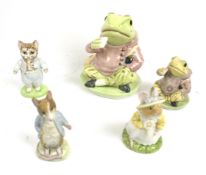 Five Beatrix Potter figures.