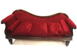A Victorian mahogany showood chaise longue.