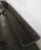 A 19th century large cast iron horse trough.