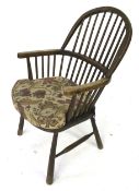 A 19th century Windsor stick back armchair with ash hoop, elm seat etc..