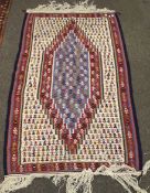 A contemporary woven rug.