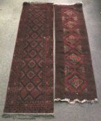 Two 20th century Persian style red wool runner rugs.