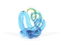 A Maltese Mdina Glass ornament. The swirled, cloud form sculpture coloured in blue and yellow, H12.