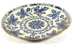 An 18/19 th century Chinese blue and white ceramic charger.