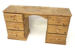 A contemporary pine double pedestal desk.