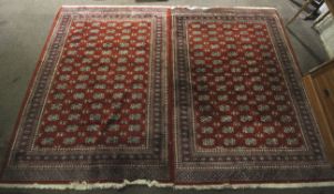 A pair of contemporary machine woven rugs.
