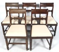 A 19 th century set of five mahogany dining chairs.