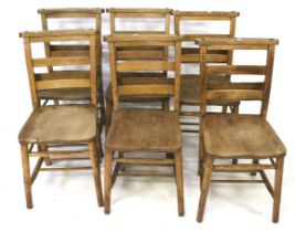 A set of six chapel chairs. With elm seats, raised on turned supports united by stretchers, H81.