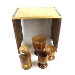 Treen ;An assortment of fruitwood items and a table. Including lidded pots, goblets, etc.