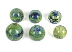 Six Mdina Maltese glass paperweights.