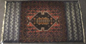 A 20th century woven rug.