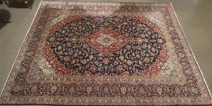 A mid-late 20 th century Persian hand woven Woollen carpet.