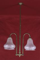 A late 19 th century brass and frosted glass two branch ceiling light fitting.