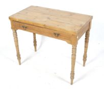 A 20th century rustic pine side table.