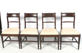 A 19 th century set of four mahogany dining chairs.