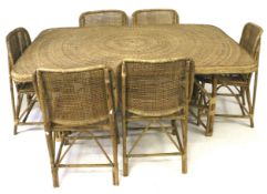 A contemporary wicker and bamboo dining table and chairs.