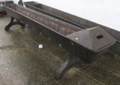 A 19th century large cast iron horse trough.