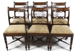 A set of six early 19th century mahogany dining chairs.