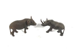 Africa : two carved black hardwood animals. Comprising a rhinoceros and water buffalo, 10 .