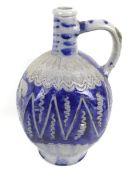 A vintage German pottery jug bottle. With blue glaze and sgraffito decoration.