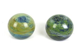 A pair of Mdina glass paperweights.