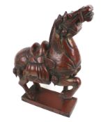 A 20th century carved wooden model of a Tang horse.