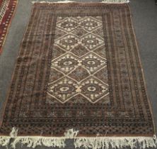 A vintage Persian style wool rug.