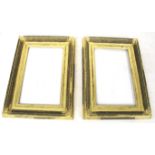 A pair of antique gilt wooden picture frames.