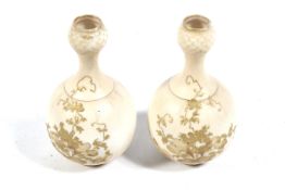 A pair of Austrian pottery bottle shape vases.