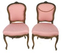 A pair of 19th century walnut Louis XV style single chairs.