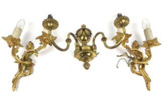 Three cast metal wall lights.