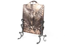 A 19 th century Arts and Crafts plannished copper and wrought iron Fire Screen.