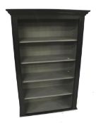 A contemporary black painted freestanding bookcase.