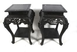 A pair of large ebonised square Chinese table stands.