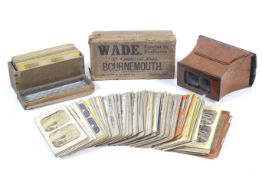 A large collection of early stereoview photographs with a Brewster type stereoscopic burr wood