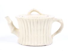 An 18/19th century Wedgwood creamware gathered caneware bamboo moulded teapot and lid.
