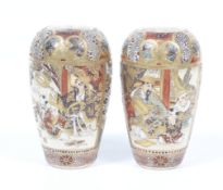 A pair of Japanese Satsuma miniature vases. Decorated with two panels of scholars teaching children.