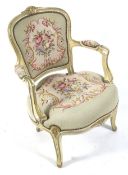 A French fauteil painted open arm chair. With embroidered seat and back.