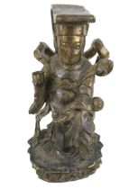 A gilt wood and plaster carving of a Chinese Emperor figure. Depicted standing on a lotus flower.