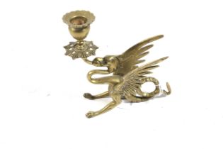 A late 19th century brass Wyvern candlestick.