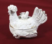 A Victorian ceramic egg holder modelled as a chicken.