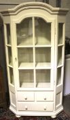 A contemporary white painted pine display cabinet.