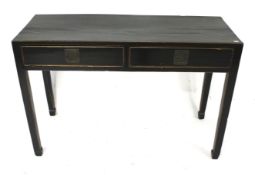 A Chinese style black lacquered two drawer console table.