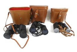 Three pairs of binoculars.