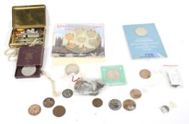 A selection of coins plus three Hudson Metropolitan police whistles.