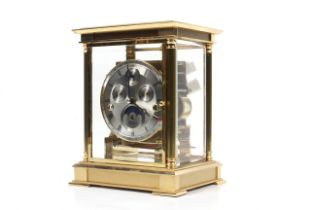 A Kieniger brass chiming mantel clock.