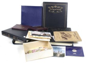 A collection of Royal family themed coin and stamp albums.