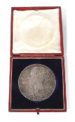 An 1897 Diamond Jubilee silver medallion. Boxed.