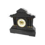 A 19th century black marble mantel clock. Striking to a gong.